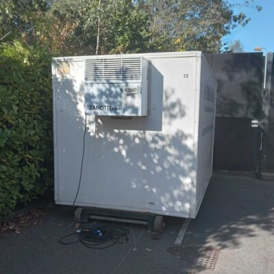 White Frostbite Refrigeration trailer parked next to a large event marquee in the North West