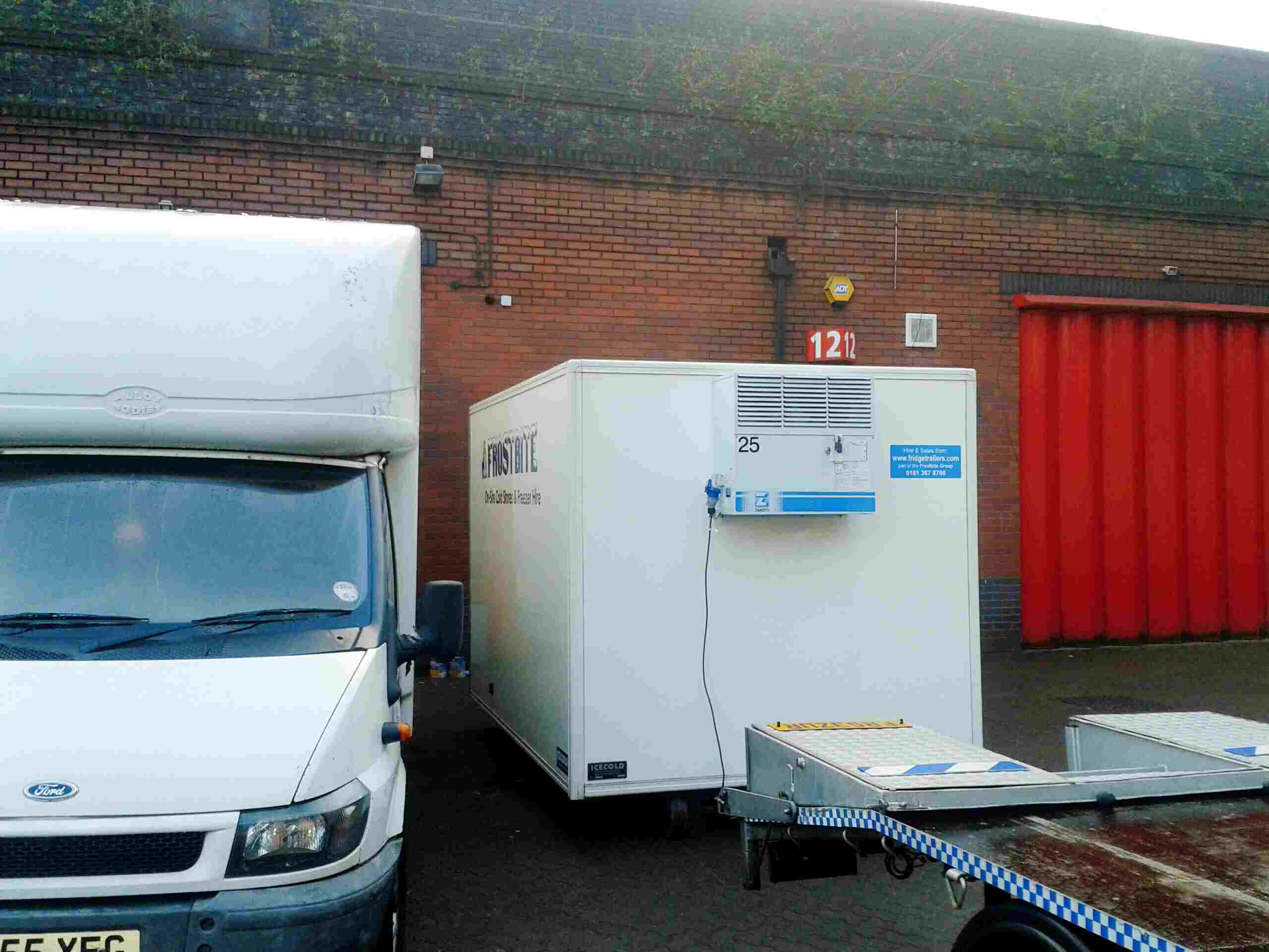 Multiple Frostbite Refrigeration trailers lined up at a North West distribution warehouse for seasonal stock management.