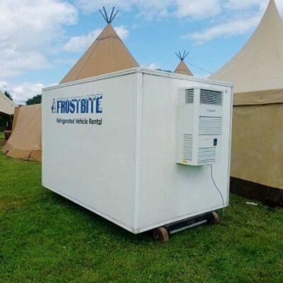 A professional fridge trailer hire North West unit parked behind a luxury wedding marquee at a venue in Cheshire.