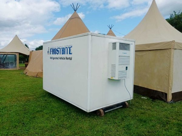 A professional fridge trailer hire North West unit parked behind a luxury wedding marquee at a venue in Cheshire.