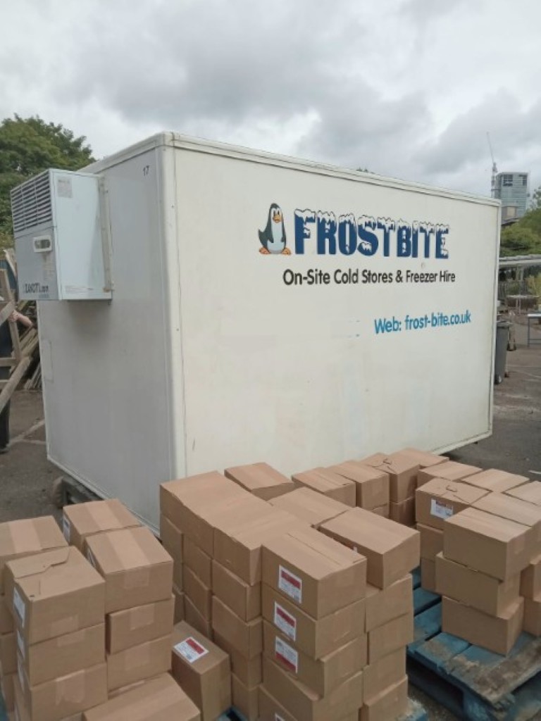 A heavy-duty Frostbite Refrigeration mobile freezer trailer being deployed for a commercial emergency in Altrincham, Greater Manchester, to prevent stock loss during a cold room failure.