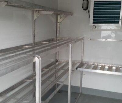 A Frostbite Refrigeration trailer parked at a luxury Cheshire wedding venue providing essential drink and cake storage.