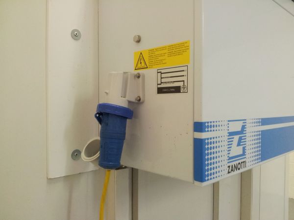 A Frostbite Refrigeration freezer trailer connected to a power supply at a North West event venue.